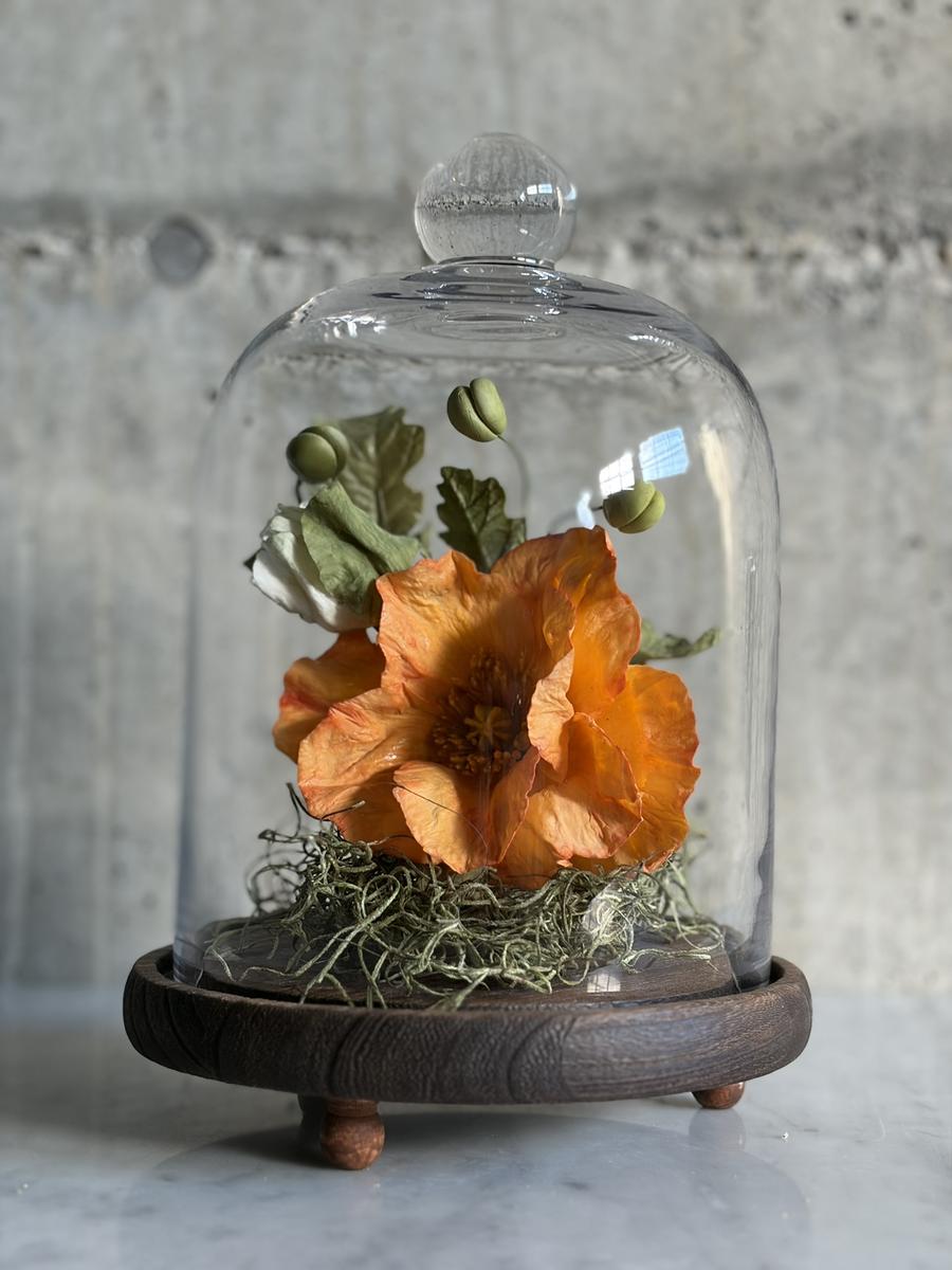 Orange flower glass dome